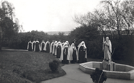 Two pictures entitled Rogation Procession (April 25) note the Mississippi River in the background of this postcard 